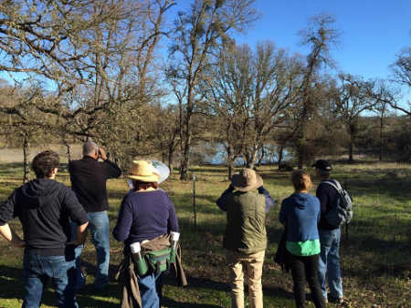 Hikers view the vernal pool from the Ridge Trail at Anderson Marsh State Historic Park in Lower Lake, Calif., on Thursday, January 1, 2015. Photo by Gae Henry. 010115fdhbinocs