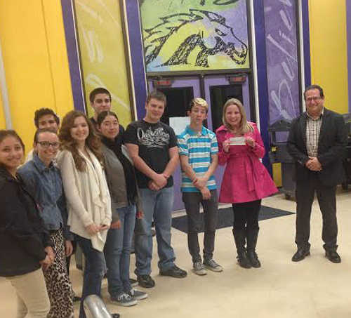 The Middletown High School Mock Trial Team accepts a check for $1,000 from Dan Nelson, vice president of Hoberg's Resort and Spa (at right) to attend the state competition, which takes place on Friday, March 20, through Sunday, March 22, 2015, in Riverside, Calif. Nelson presented the check during the Middletown Unified School District's meeting on Wednesday, February 25, 2015. Courtesy photo. 022515mhsmocktrialcheck