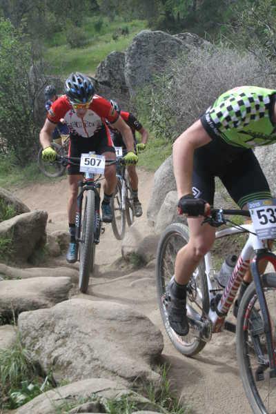 Nathan Barnett hammers through a rock garden at the Granite Bay Grinder in Granite Bay, Calif., on Saturday, March 14, 2015. Photo by Tami Cramer. 031415mtnbikerocks