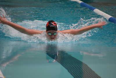 Shannon Fronsman winning the 100 yard Butterfly event in Calistoga, Calif., on Thursday, March 19, 2015. Photo by Beth Rudnick. 031915swimteamfronsman