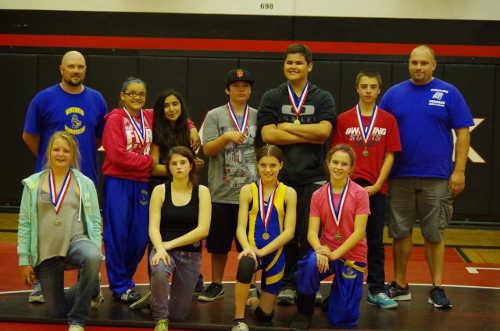 Terrace Viking wrestlers at the league meet on Thursday, March 26, 2015. Back row, Coach Rick Pyorre, Mia Depaz-Flores, Lupita Heredia, George Fred, Will Green, Sergio Rodriguez and Head Coach Steve Fisher; front row, Teagan Miller, Scarlett Ballard, Bryanna Johnson and Mavis Pyorre. Photo courtesy of Rick Pyorre. 032615terracewrestlersgroup