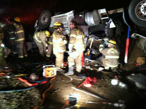 Northshore Fire Protection District firefighters work at the scene of a semi rollover which occurred on Highway 20 near Lucerne, Calif., on Saturday, March 28, 2015. Photo courtesy of Pat Brown. 032815semicrash2