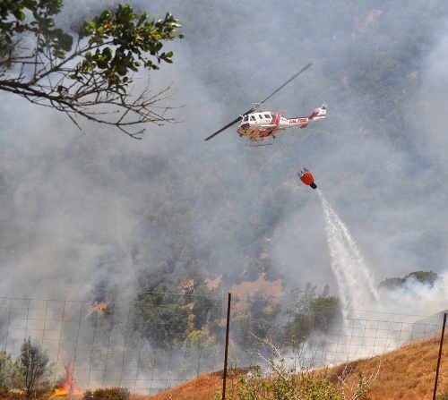 Cal Fire Copter 104, which is based in Lake County, Calif., worked the Chiles Fire in neighboring Napa County, Calif., on Tuesday, June 16, 2015. Photo courtesy of Cal Fire. 061615chilescopter