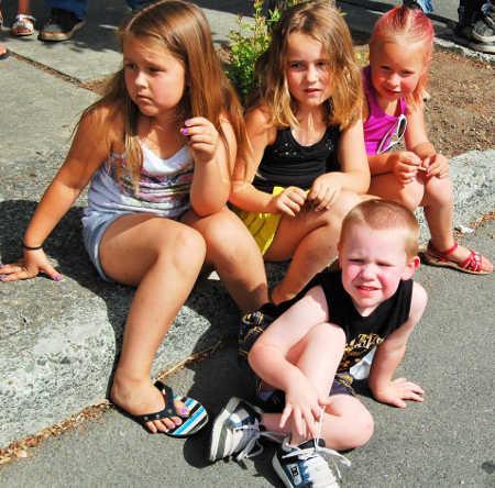 From left, Tierra, Kaylie, Addy and Colbyn Logrin enjoy the Middletown Days Parade on Saturday, June 20, 2015, in Middletown, Calif. Photo by John Lindblom/Lake County News. 062015mtowndayskids