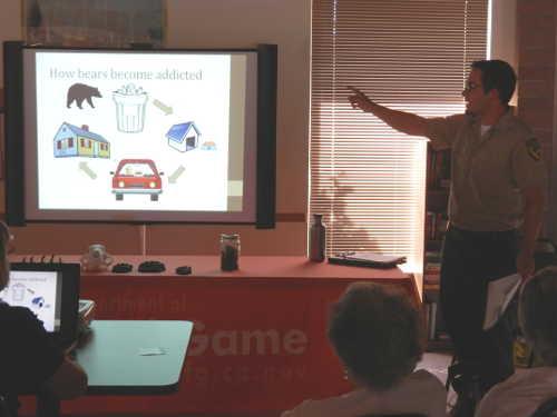 California Department of Fish and Wildlife Biologist Joshua Bush leads a “bear aware” presentation on Thursday, July 16, 2015, in Clearlake Oaks, Calif., aimed at educating the public in living responsibly in bear country. Photo by Denise Rockenstein/Lake County News. 071615bearawareevent
