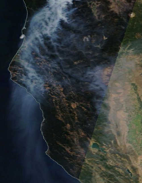 A satellite image from the National Aeronautic and Space Administration taken on Monday, September 1, 2014, showed thick smoke from the Happy Camp Complex in far Northern California, which appears to be responsible for sending smoke south toward Lake County, Calif. Clear Lake is the green object seen to the right in the lower quarter of the image. Image courtesy of NASA. 090114smokeimage2