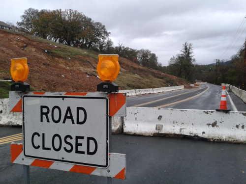 Saturated soil at the Lakeside Heights subdivision in north Lakeport came down the hill and into the roadway on Hill Road East as a result of the major storm that hit the area on Thursday, December 11, 2014. The county of Lake had closed a portion of Hill Road East on Tuesday, December 2, 2014, due to concerns that the landslide might move down the hill. Photo by Chad Samuelson. 121114lakesideheightschad