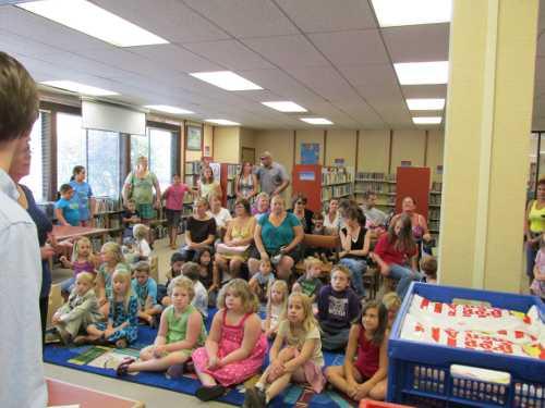 Children who participate in the Lake County Library’s summer reading program earn prizes by reading library books over the summer. In 2013 260 children completed the program and read nearly 8800 books between them. They received their prizes at parties like this one which was held at Lakeport Library. Photo courtesy of the Lake County Library. 2013librarystorytime