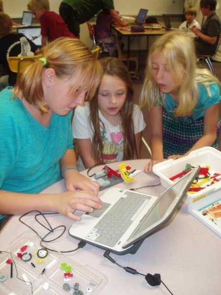 Students in the Riviera after school program build Lego robots in 2013. Photo courtesy of the Children’s Museum of Art and Science. cmasrivstudents