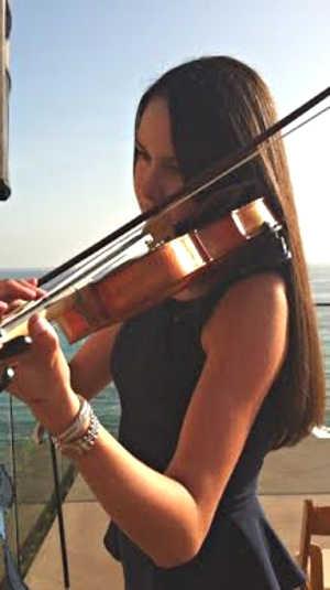 In 2015, 12-year-old Julianne Carter of Hidden Valley Lake, Calif., will travel to Interlochen, Mich., for the second summer in a row to student at the renowned Interlochen Arts Camp. Photo courtesy of Angela Carter. juliannecarterweddingplay