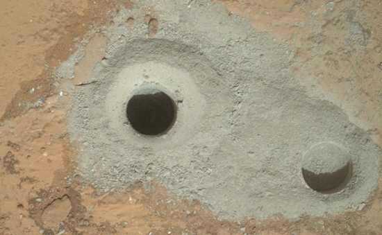 At the center of this image from NASA’s Curiosity rover is the hole in a rock called “John Klein” where the rover conducted its first sample drilling on Mars. Image credit: NASA/JPL-Caltech/MSSS. 020813marsdrillingarea