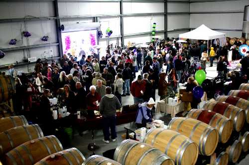 Crowds enjoy a variety of booths inside the Chacewater Winery during the Kelseyville Olive Festival in Kelseyville, Calif. Courtesy photo. 2012kofaerialview