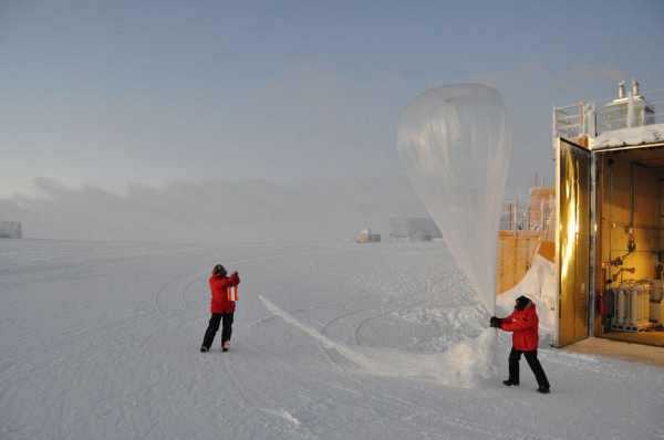 Staff at the South Pole get ready to release a balloon that will carry an ozone instrument up to 20 miles in the atmosphere, measuring ozone levels all along the way. NOAA image from 2011. Credit: NOAA. 2011ozonelayer