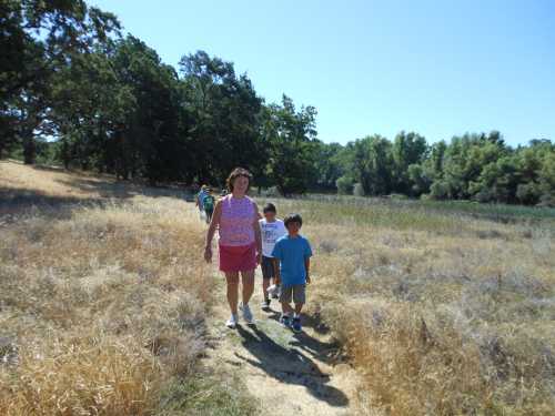 Youth enjoy a walk at the Rodman Preserve during one of last summer’s nature education programs. Support the Land Trust by attending the annual Spring Dinner at the Saw Shop Gallery Bistro on Monday, May 13, 2013. Courtesy photo. landtrustwalk