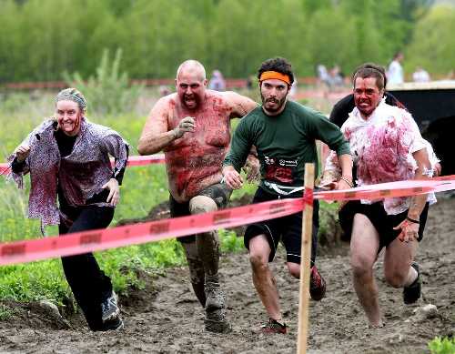 Runners take part in a “Run for Your Lives” event in Northern California. The charity run will come to Clearlake Oaks, Calif., on Saturday, May 11, 2013. Courtesy photo. zombierunners
