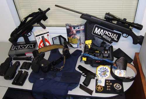 A cache of law enforcement equipment was found at the home of Antonio Hector Molinar, 66, of Hidden Valley Lake, Calif., on Thursday, August 22, 2013. Photo courtesy of Lake County Sheriff's Office. 082213molinarweapons