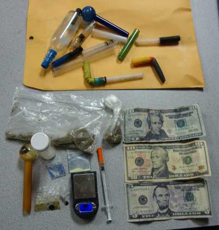 Drug paraphernalia and counterfeit currency were taken during a traffic stop in Lake County, Calif., on Friday, Aug. 23, 2013. Photo courtesy of the Lake County Sheriff's Office. 082313drugsandheroin