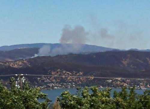 Amelia Ott took this picture of the Sulphur Bank Mine Road fire's smoke plume from the Clear Lake Riviera. The fire was burning in Clearlake Oaks, Calif., on Saturday, August 24, 2013. 082413ottsulphurfire