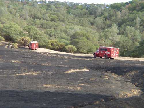 Cal Fire units remained at the scene of a fire on Sulphur Bank Mine Road in Clearlake Oaks, Calif., on Saturday, August 24, 2013. Photo by Elizabeth Larson. 082413sulphurfirecalfire