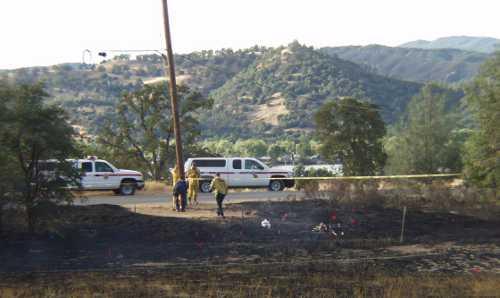 Fire investigators work at the scene of a fire on Sulphur Bank Mine Road in Clearlake Oaks, Calif., on Saturday, August 24, 2013. Photo by Elizabeth Larson. 082413sulphurfireinvestigation