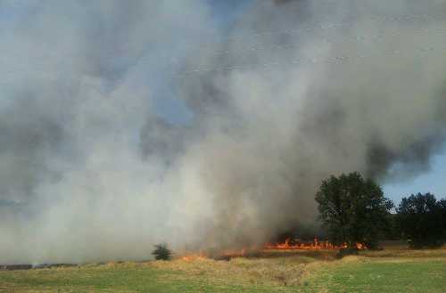 A fire was sparked along Highway 29 south of Lower Lake, Calif., on Wednesday, July 3, 2013, following a vehicle crash into a utility pole. Photo by Brenda Roofener. 070313roofenerfire