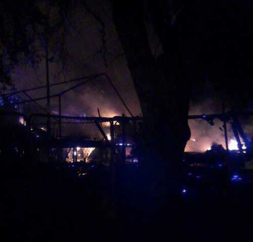 A fire burned a structure and threatened others in Clearlake, Calif., on Sunday, July 14, 2013. Photo courtesy of Kimberly Willis. 071413willisfire