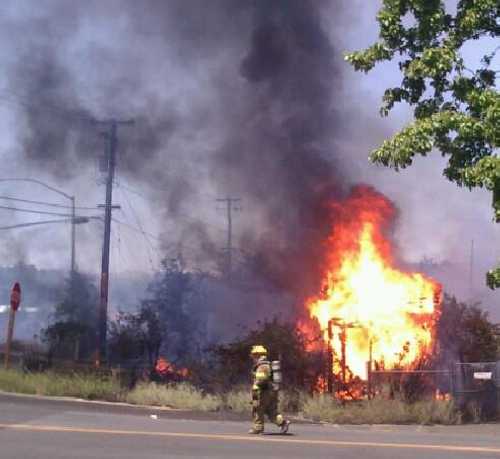 A firefighter works at the scene of a fire in Lower Lake, Calif., on Wednesday, July 17, 2013. Photo by April Loughry. 071713jessie2