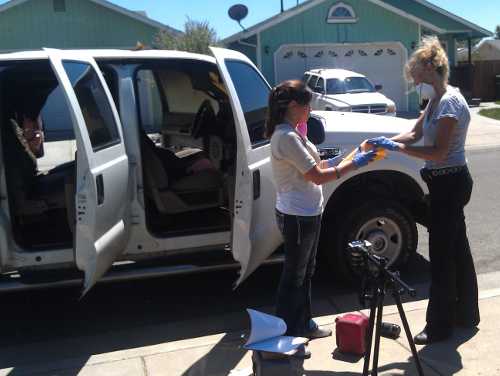 Lake County Sheriff's Office evidence technicians process a burned pickup belonging to Rob and Sara Sanchez of Upper Lake, Calif., on Wednesday, July 31, 2013. Photo by Elizabeth Larson. 073113sancheztruck1