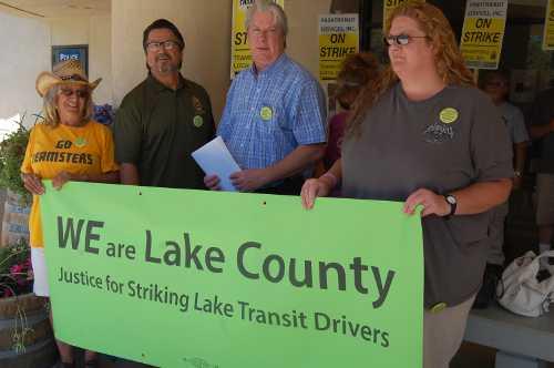 From left to right, Teamsters Local 665 members JoAnn Scribner, Ralph Miranda, Mark Gleason and Shawna Theodorou at a rally in Clearlake, Calif., on Friday, August 2, 2013. Photo by John Lindblom. 080213teamsterspicket