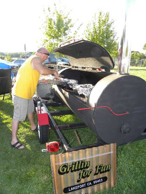 Several teams will be vying for top honors at the “Grillin’ on the Green” fundraiser on Saturday, August 3, 2013, in Lakeport, Calif. Shown is grilling action from a previous event event. Courtesy photo. grilleratgrillin