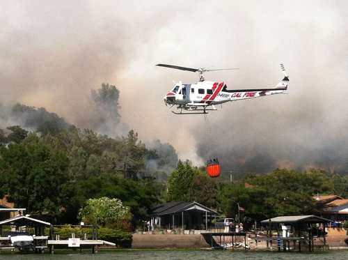 One of two Cal Fire helicopters being used to fight a fire at Patterson and Lakeshore drives in Clearlake Park, Calif., on Wednesday, June 5, 2013. Photo by Sheri Salituri-Young. 060513pattersonfirecopter