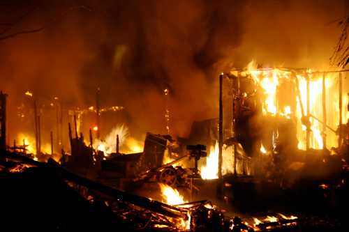 By the time firefighters arrived on the scene of a house fire in in Spring Valley near Clearlake Oaks, Calif., early on the morning of Monday, June 10, 2013, the home already was fully gulfed in flames. Photo by Kenneth R. Wells. 061013springvalleyfire2