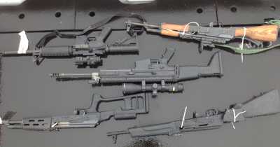 Five assault weapons were seized during the North State Marijuana Investigation Team operations. Photo courtesy of the California Attorney Generals’ Office. 032113agweapons