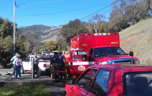 Northshore Fire Protection District firefighters place Ann Adams, 71, of Lucerne, Calif., in an ambulance after she was rescued from her pickup, which went into Clear Lake and sank, on Thursday, March 21, 2013. Photo by Elizabeth Larson. 032113lucernepickupfire