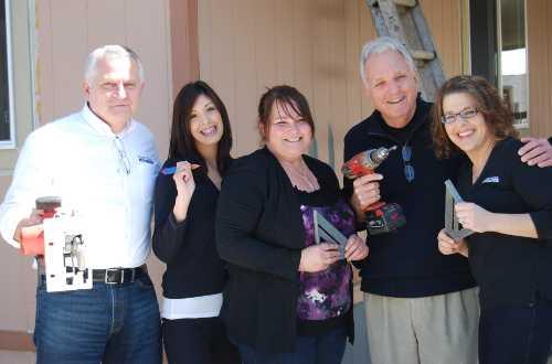 From left to right, Mendo Lake Credit Union Chief Executive Officer Richard Cooper, Angelina Ramirez, future homeowner Callie Swift, Richard Birk of Habitat for Humanity and Jamey Gill of Mendo Lake Credit Union celebrate Habitat for Humanity’s first home project in Lakeport, Calif. Photo courtesy of Habitat for Humanity Lake County. march2013hfhhouse17