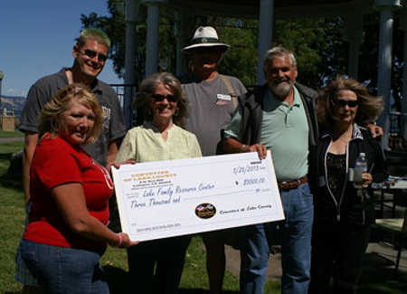Tim Boone, Andy Peterson, Jim Hilton, Gail Salituri, Sandy Thompson and Gloria Flaherty at the end of the annual “Run to the Lake” Corvette show in Lakeport, Calif., on Sunday, May 26, 2013. Photo by John Yde. 052613corvettesdonationfinal