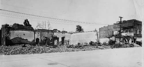 “The brick walls of the Monroe building crumbled in the intense heat, only two stark corners standing to mark the site.” (Lake County Bee, 4/21/1926). This view shows the burn area of the 1926 fire along Main Street from Third Street to Fourth Street. Only the Hartley Lodge building survived in this block. Courtesy of Lake County Museum. 1926lakeportfiremonroebldg