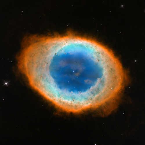 In this composite image, visible-light observations by NASA’s Hubble Space Telescope are combined with infrared data from the ground-based Large Binocular Telescope in Arizona to assemble a dramatic view of the well-known Ring Nebula. Credit: NASA, ESA, C.R. Robert O’Dell (Vanderbilt University), G.J. Ferland (University of Kentucky), W.J. Henney and M. Peimbert (National Autonomous University of Mexico) Credit for Large Binocular Telescope data: David Thompson (University of Arizona). ringnebulacloseup