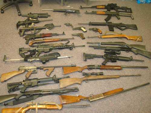 Twenty-six firearms were seized during the service of a search warrant on Tuesday, September 17, 2013, in Lake County, Calif. Photo courtesy of the Lake County Sheriff's Office. sept2013guncache