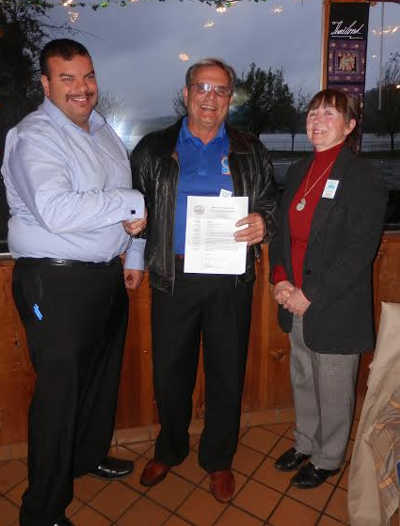 Clear Lake Chamber of Commerce President Alvaro Valencia (left) presents a letter of official endorsement in support of Measure L to Committee to Save the Lake Chairman Jim Magliulo and committee member Victoria Brandon on Tuesday, April 2, 2014. The endorsement was supported unanimously by chamber membership. Photo by Denise Rockenstein/Lake County News. 040114chamberendorse