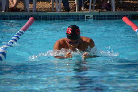 Andres Tejeda – Senior at Clear Lake High School – swimming the 100 yard Breaststroke event on Thursday, April 10, 2014. Photo by Beth Rudnick. 041014tejedaswimmeet
