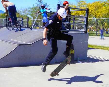 Officer Travis Parsons shows off his boarding skills at the annual “Andy Day” at the Clearlake Skate Park on Saturday, April 12, 2014, in Clearlake, Calif. Photo by Denise Rockenstein. 041214copskate