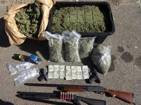 Marijuana, hash oil, firearms and cash were among the items seized during a search warrant service on Thursday, May 29, 2014, in Upper Lake, Calif. Lake County Sheriff's Office photo. 052914mcluskeypotandguns