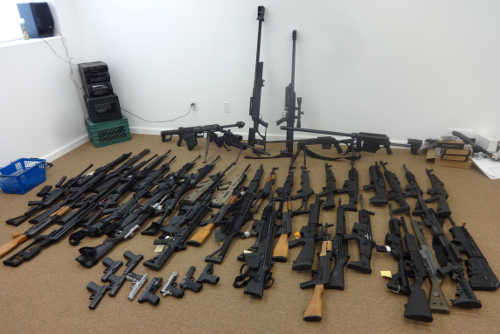 Detectives found 61 firearms, including numerous assault weapons, during the service of three search warrants at properties in Upper Lake and Lake County, Calif., on Friday, June 27, 2014. Lake County Sheriff's Office photo. 062714jonesfirearms