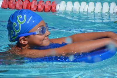 Brooke Hinchcliff, a new Channel Cats this summer, swimming in the 50 Yard Kickboard Race during a “training” meet held at the Westshore Pool in Lakeport, Calif., on Saturday, July 12, 2014. Photo by Beth Rudnick. 071214channelcatshinchcliff