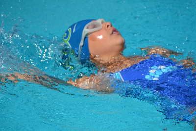 Madelyn Madrzyk, swimming in her first competitive meet, participated and ultimately won the 25 Yard Backstroke event at a training meet held at the Westshore Pool in Lakeport, Calif., on Saturday, July 12, 2014. Photo by Beth Rudnick. 071214channelcatsmadryzk