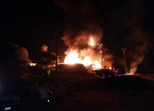 A fire burned two homes and a garage in Nice, Calif., on Saturday, August 2, 2014. Photo courtesy of Austin Camberg. 080314austincambergfire