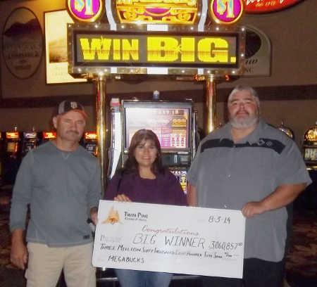 From left, an East Bay man and his wife, whose names were not released, won a $3 million jackpot at Twin Pine Casino and Hotel in Middletown, Calif., on Sunday, August 3, 2014. They're pictured here receiving their winnings from a casino official. Photo courtesy of Twin Pine Casino and Hotel. 080314twinpinejackpot