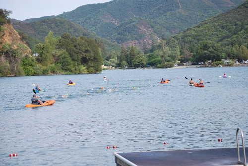 The Channel Cats swim team on its way to Pine Acres during its fourth annual Blue Lakes Open Water swim on Monday, August 4, 2014, in Upper Lake, Calif. Photo courtesy of the Channel Cats. 080414channelcatsbluekayaks