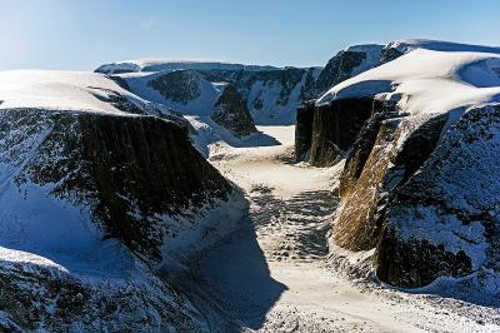 This is picture of a glacier near Penny Ice Cap on Canada's Baffin Island seen during the April 23, 2014, IceBridge survey flight. Credit: NASA/Michael Studinger. nasapennycapglacier
